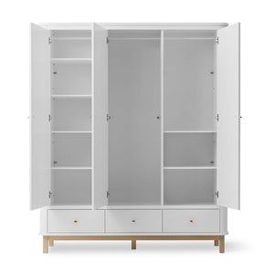Open wooden wardrobe showing adjustable shelves and hanging rail interior