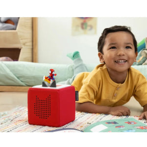 Kids in yellow t shirt listing to Spiderman Tonie Go Webs Go!