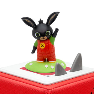 Bing the bunny smiling and waving his hand.