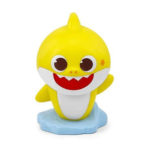 Close-up front view of the hand-painted, yellow Tonies Baby Shark magnetic audio figure standing on a light blue wave base.