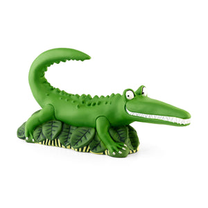 A close-up shot of the green, hand-painted Enormous Crocodile Tonie figurine, showing its long body, wide eyes, and sharp white teeth.