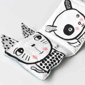 Soft fabric pages of Friendly Face in the Garden baby book.