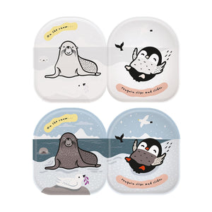 Penguin-shaped bath book with black-and-white animal illustrations