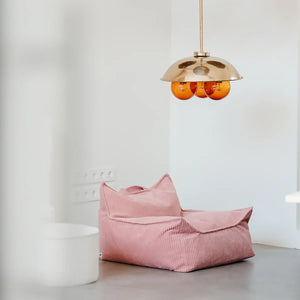 The beanbag chair is nicely decorated in a room.