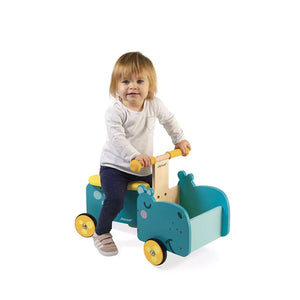 Girl is playing with hippo ride