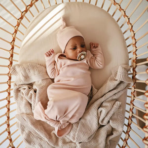 Baby in a mosaic basket