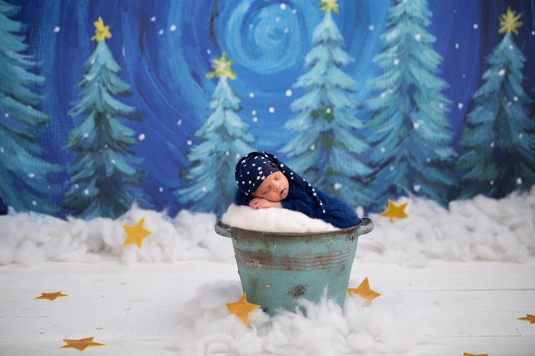 Baby sleeping with christmas gifts