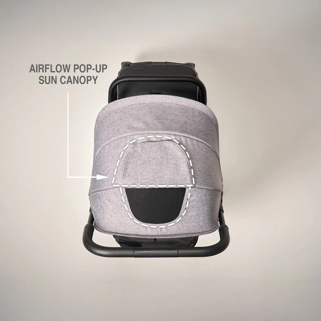 Grey stroller airflow pop-up sun canopy on a beige background.
