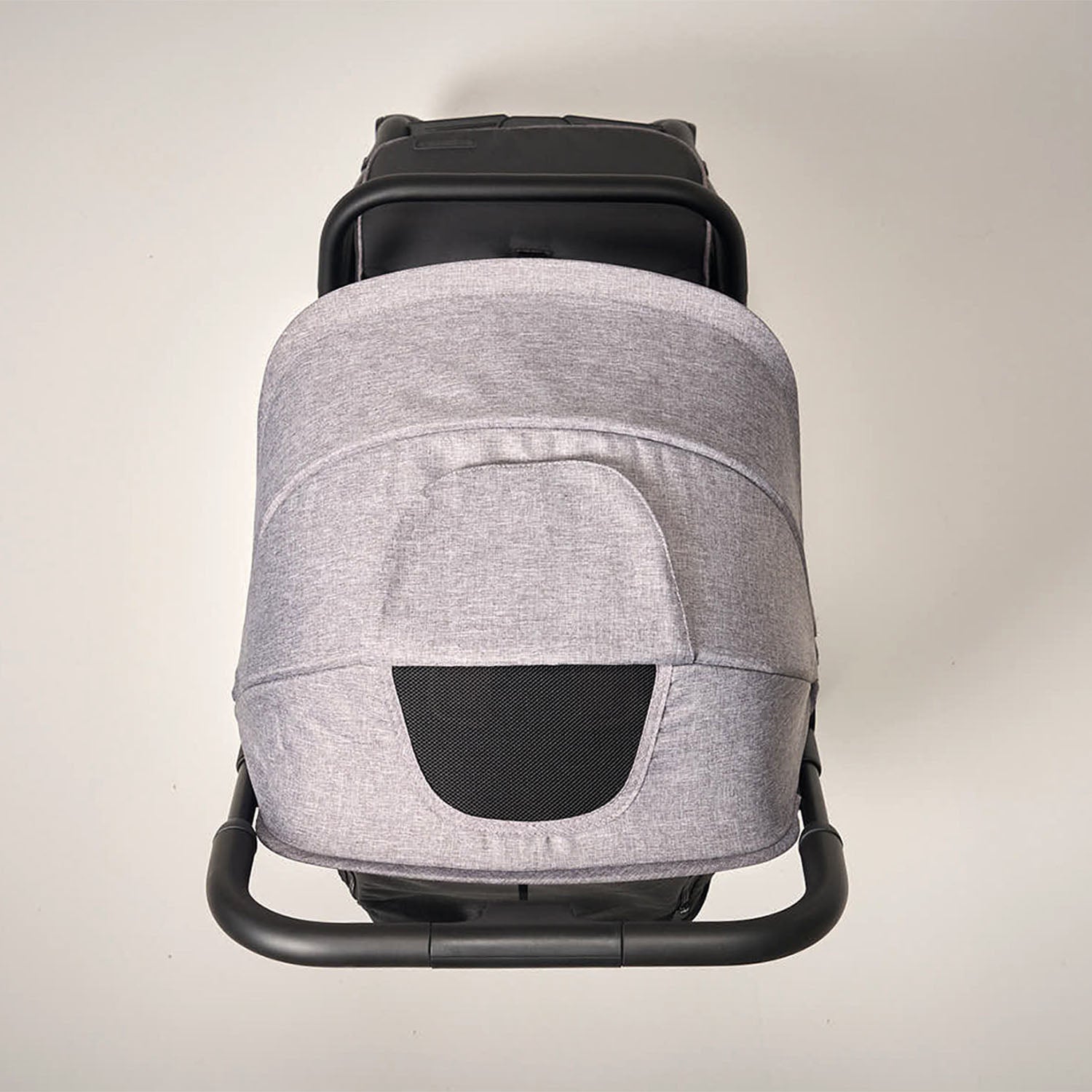 Grey canopy with black accents on a light grey stroller