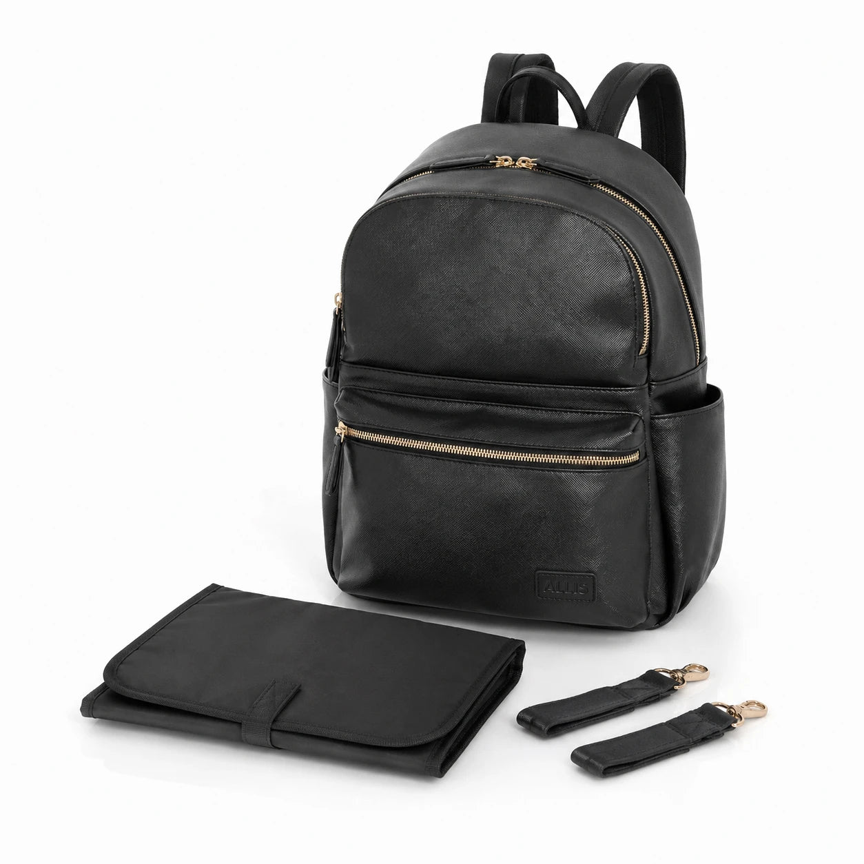 A black leather backpack with gold-tone zippers, shown with a matching black foldable changing mat and two detachable shoulder straps on a white background.