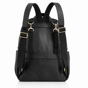 A black changing backpack with gold-tone hardware, featuring dual shoulder straps, adjustable side straps with gold buckles, and a front slip pocket, shown against a plain white background.