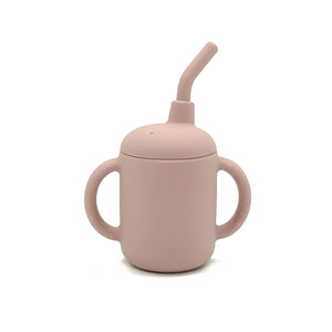 Front view of blush pink silicone sippy cup with dual handles and built-in straw.