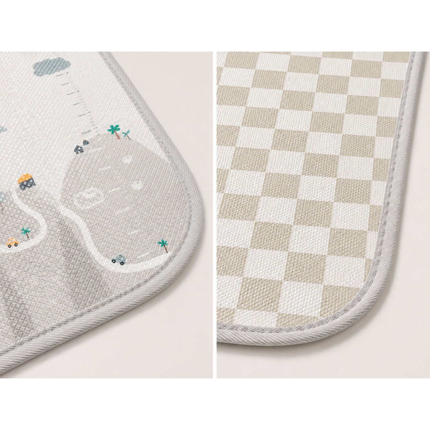 Two close-up views of a soft rectangular mat with rounded corners and stitched edges, shown side by side. The left view shows a light gray textured surface with a small illustrated road, palm tree, and vehicle motif.