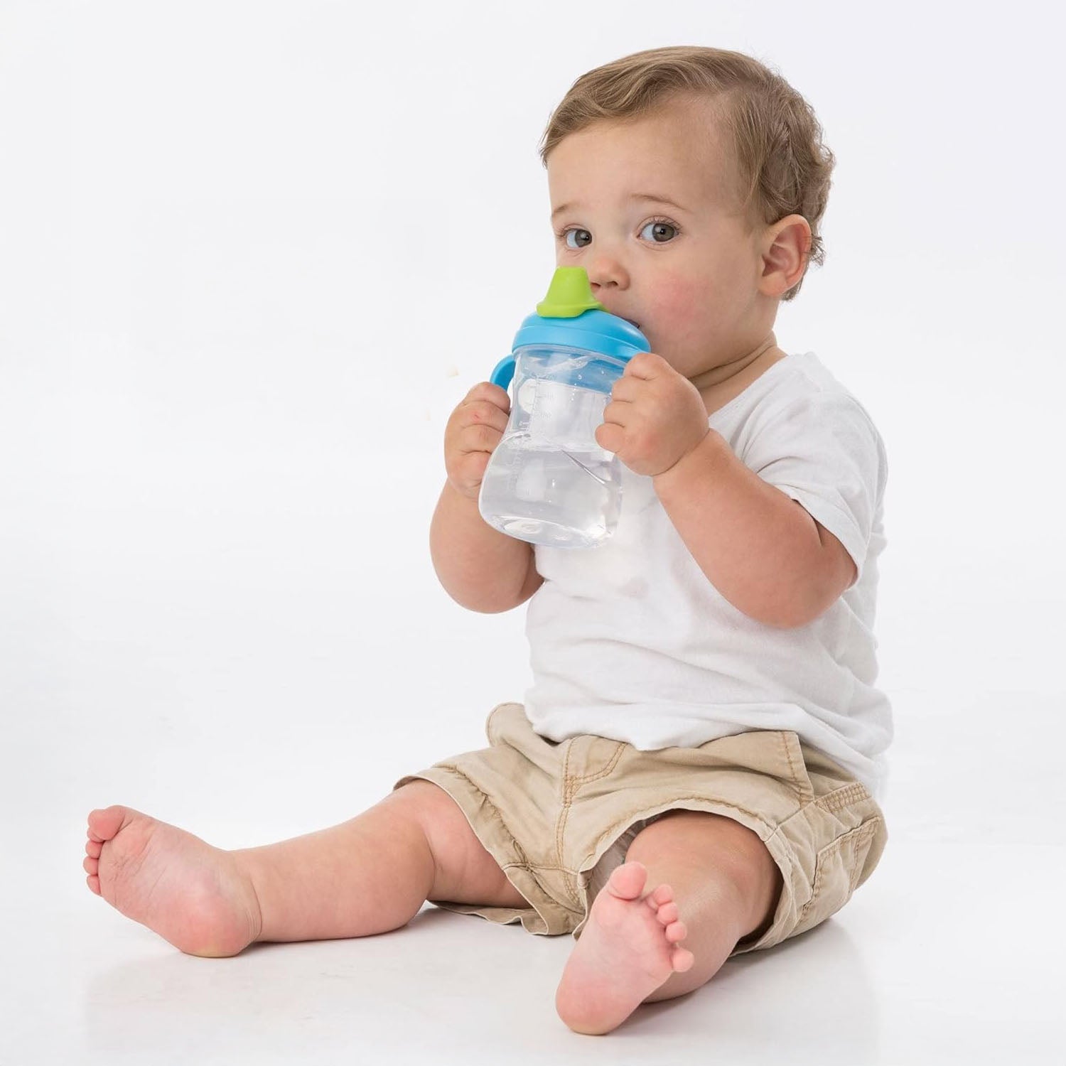 A baby is drinking water with b.box spout cup.