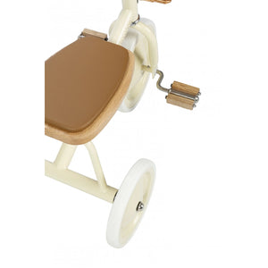 Banwood Trike (Cream) displayed in a playful setting