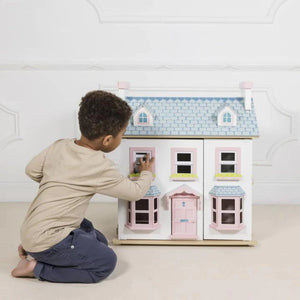 Boy Playing with Wooden Dollhouse Mayberry Manor Le Toy Van