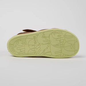 Camper shoe in white background.