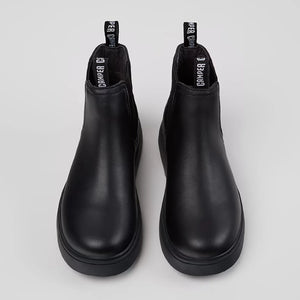 Durable rubber outsole of Camper black leather ankle boots for kids.