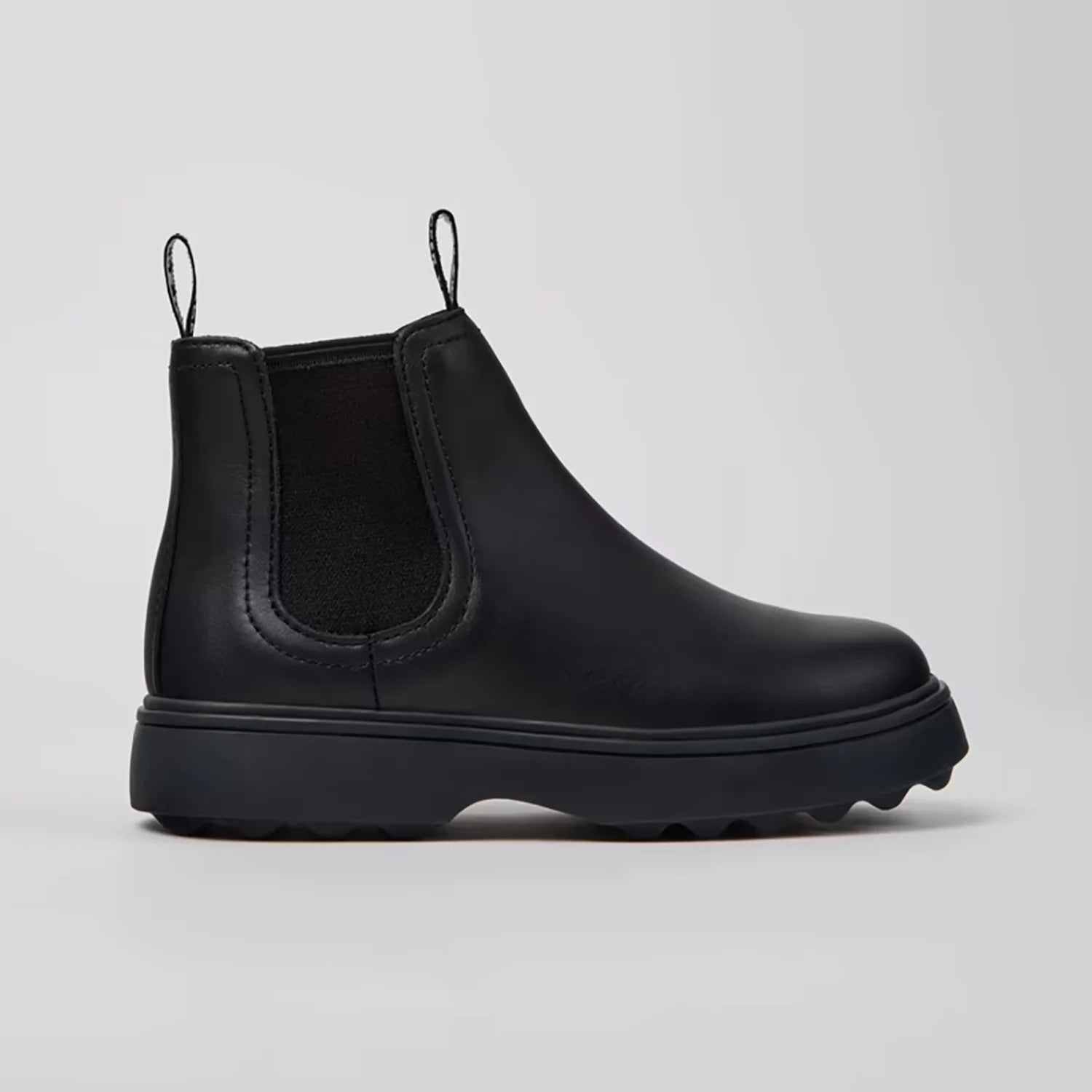 Side view of Camper black calfskin ankle boots for children