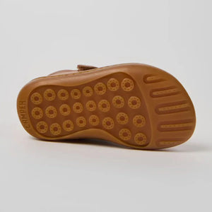 Showing bottom of the camper first walkers shoes.