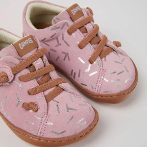 Front view of the pink baby shoes.