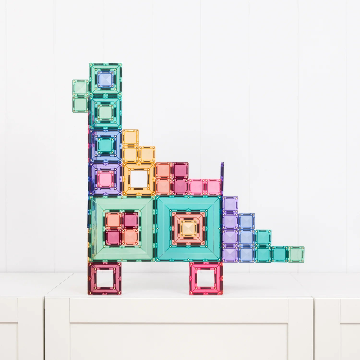 Modular magnetic tiles combined into larger creative builds