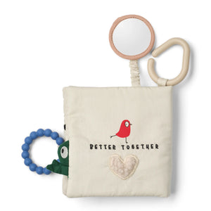 Liewood baby book with baby-safe mirror, red bird detail, and blue silicone teether — sensory play feature