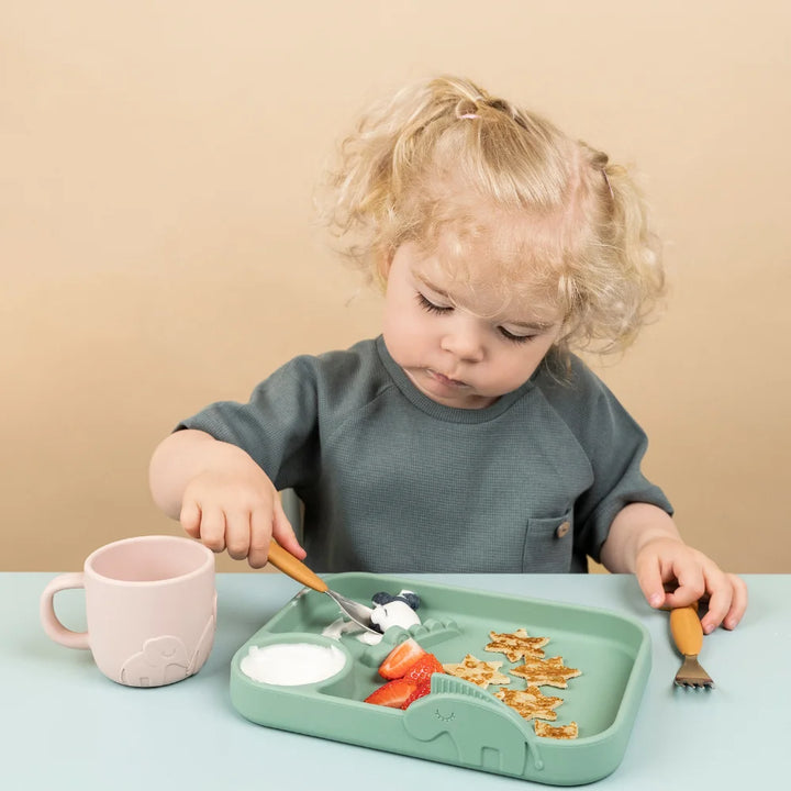 Girl Enjoying Mealtime with Done By Deer Silicone Kids Cutlery