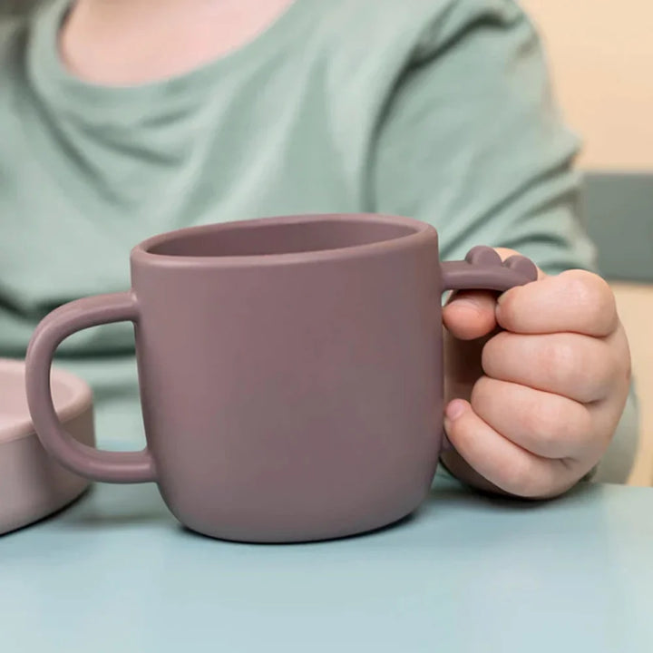 Girl Holding Silicone Two Handled Training Cup