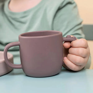 Girl Holding Silicone Two Handled Training Cup