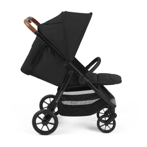 Stroller hood extended on a sunny day.