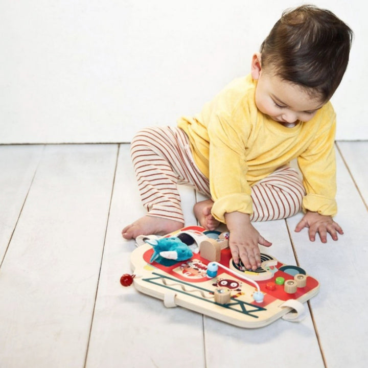 Child Playing With Wooden Toy