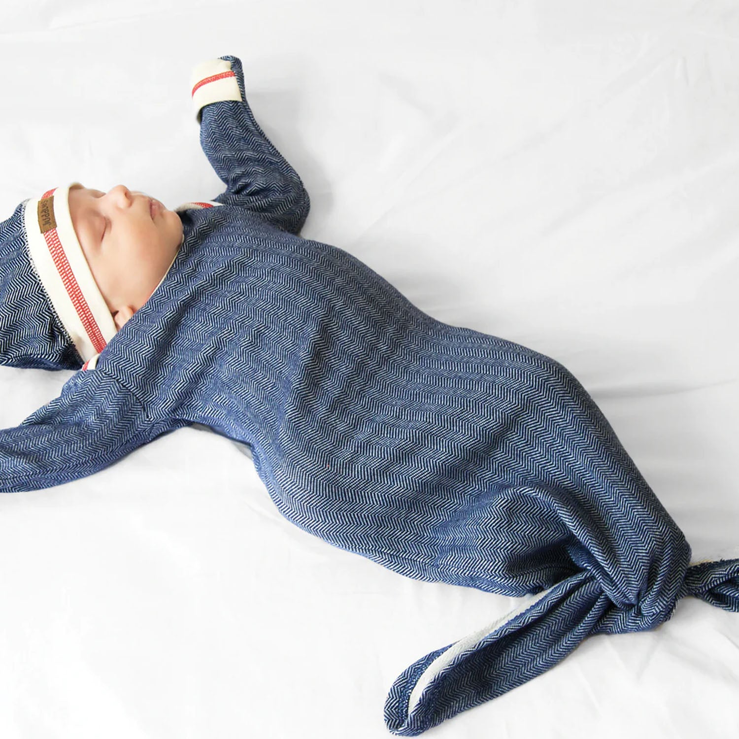 Baby wearing a Cottage Collection knotted gown for easy diaper changes.