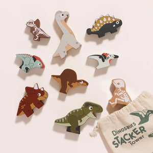 Compact cotton drawstring bag with wooden dinosaur stackers inside, perfect for storage and travel.