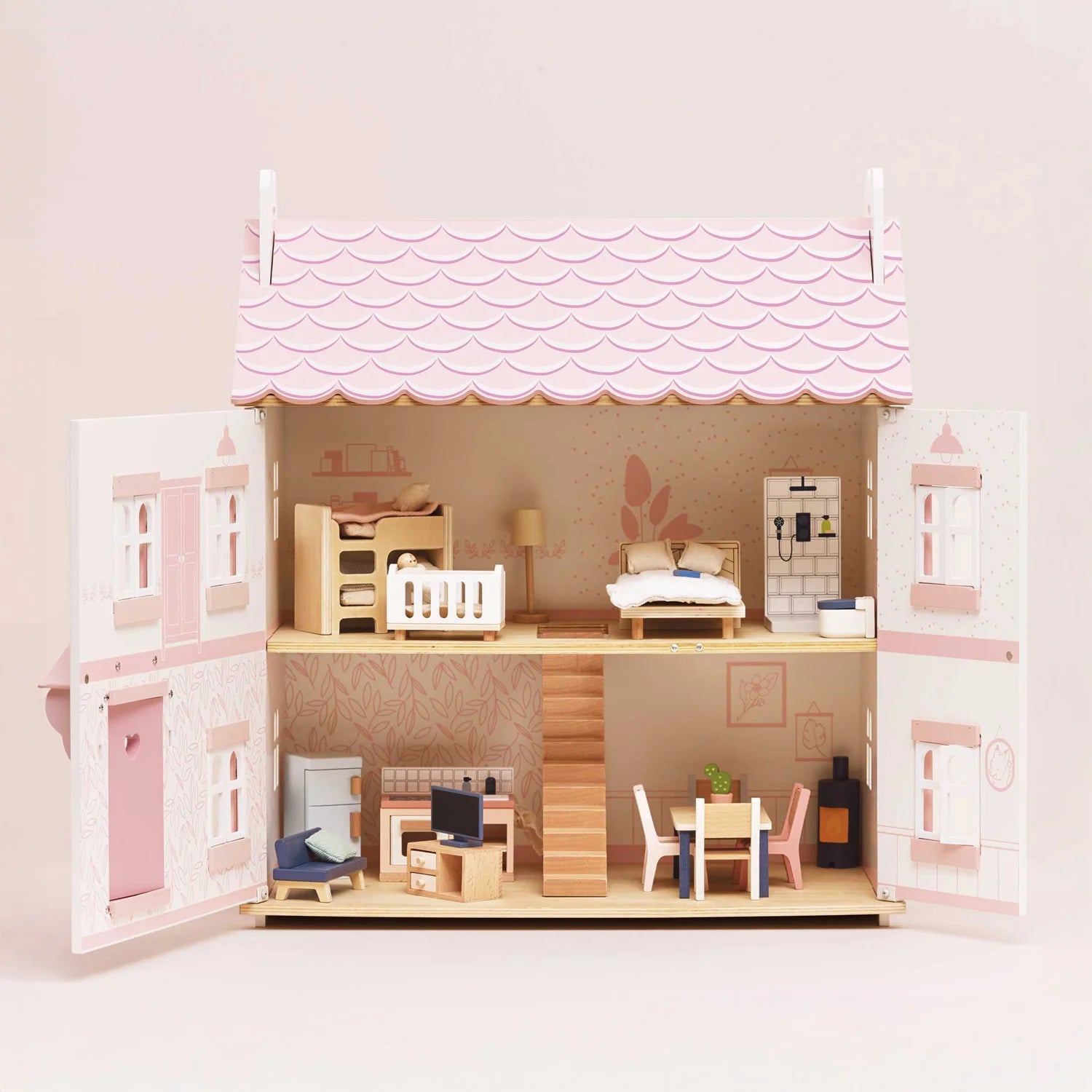 Showcasing le toy van dolls house with furniture.
