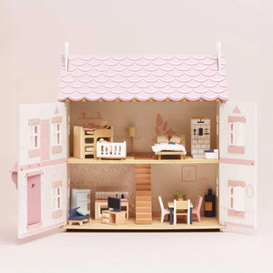 Showcasing le toy van dolls house with furniture.