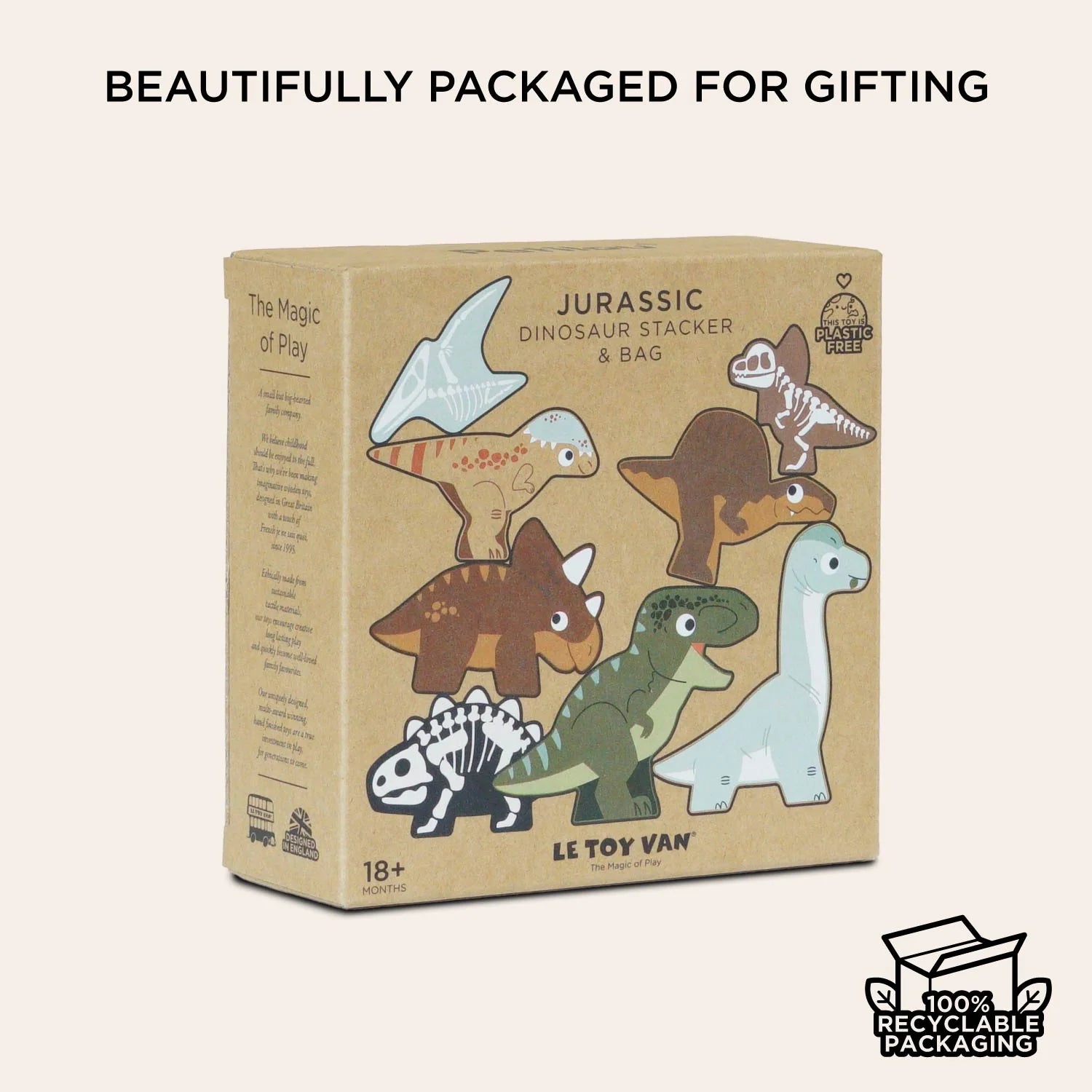 Box of dinosaur toys with illustrations on a beige background