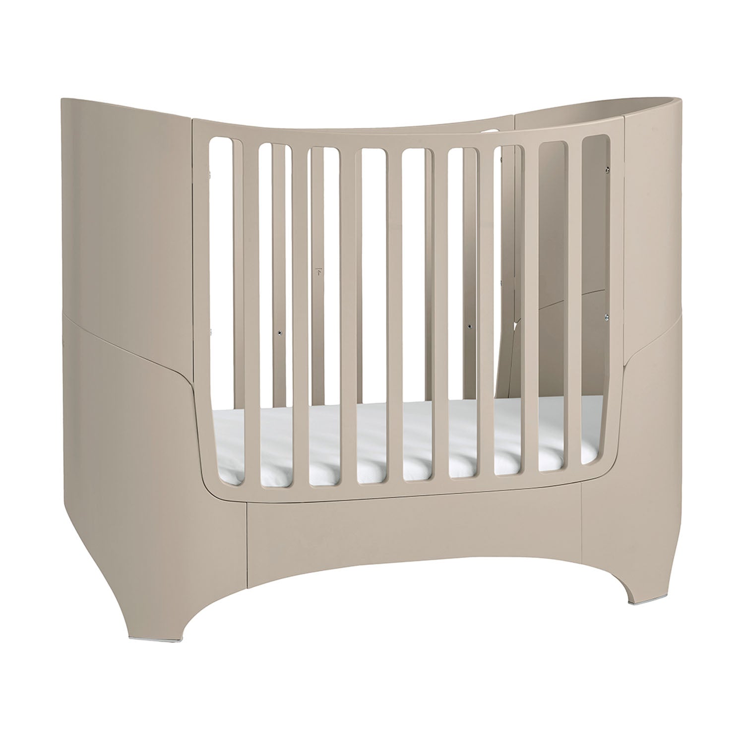 Timeless oval wooden crib with high sides for newborn safety.