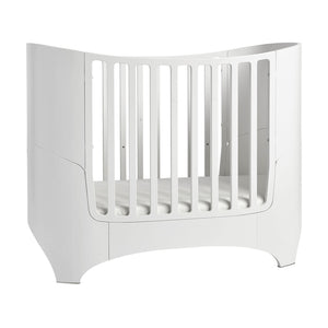 Leander bed staged for newborn with high sides.