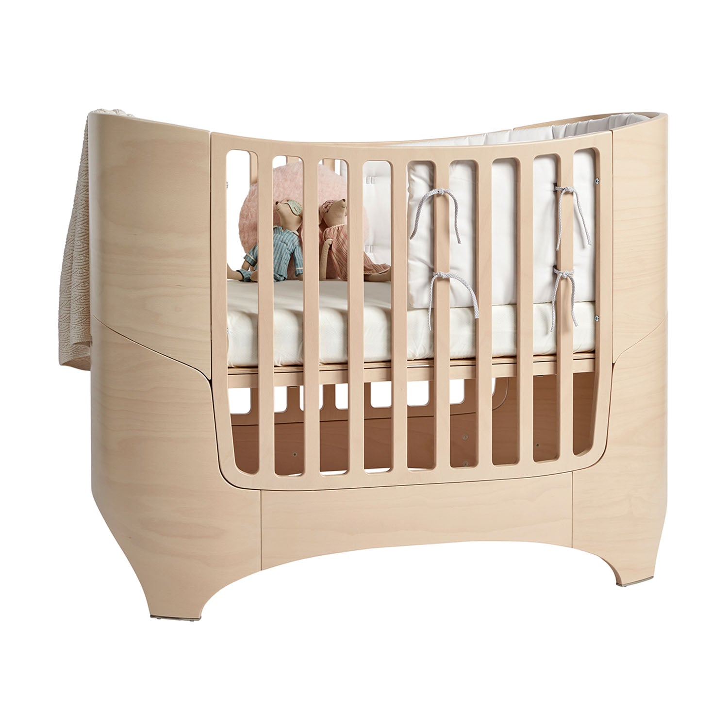 Leander Classic crib styled with fitted oval sheet.