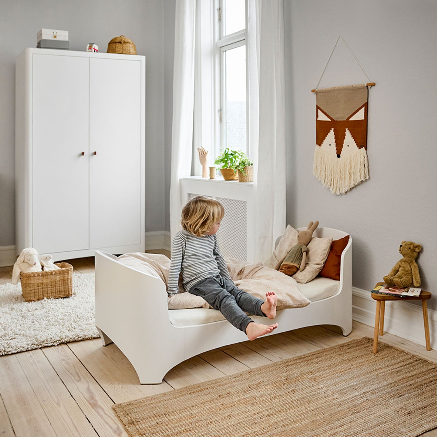 Growing child using adapted Leander junior bed.