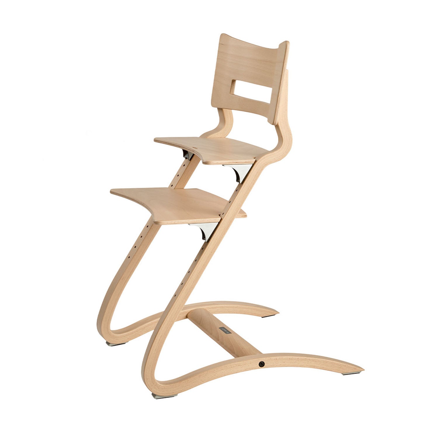 The Leander Classic highchair converted into an adult-sized chair in whitewash colour.