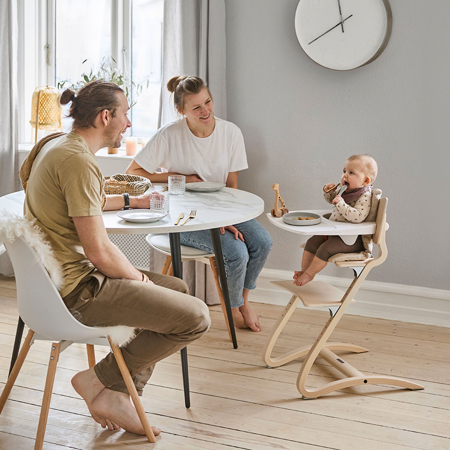 Leander highchair with a soft grey cushion accessory for extra comfort.