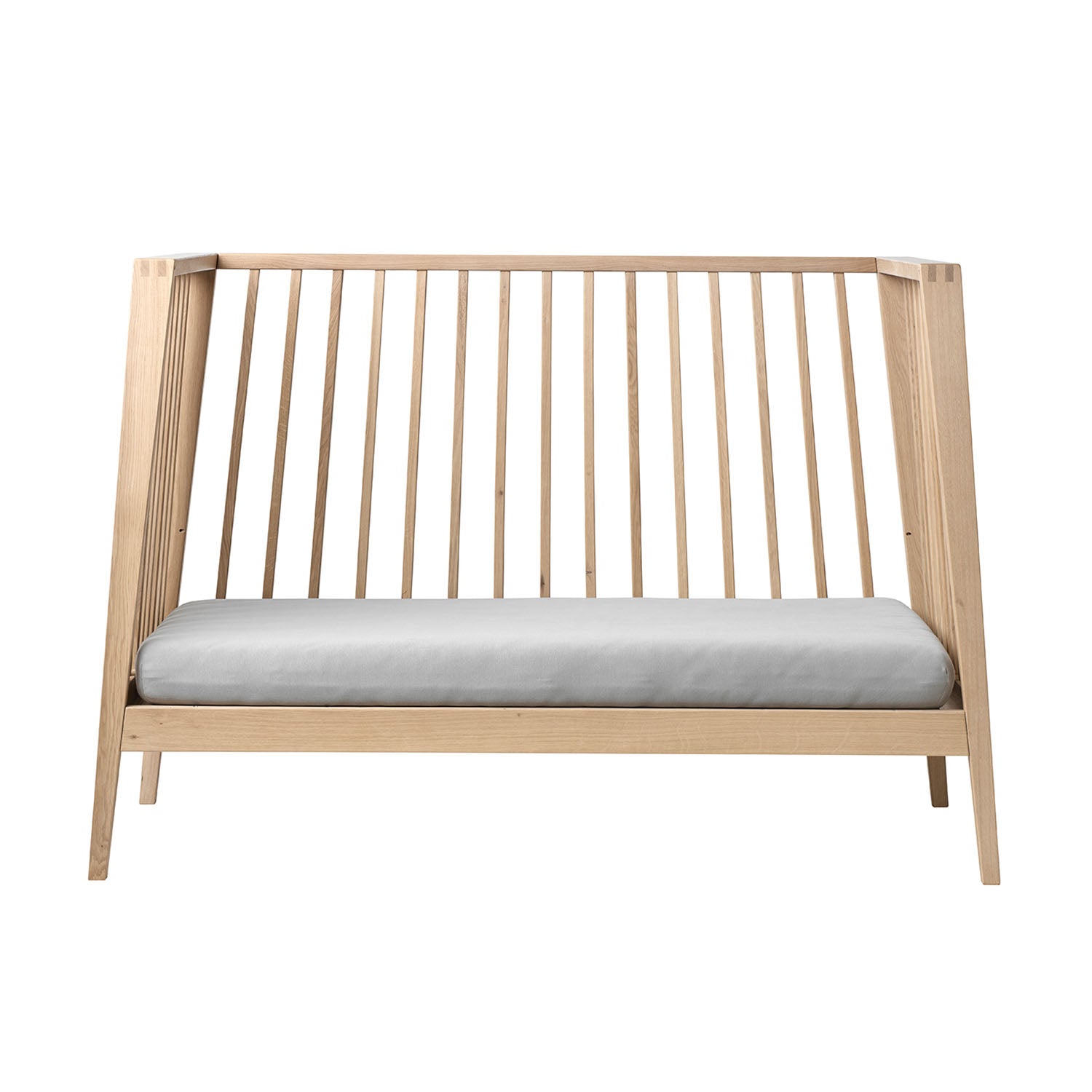 Leander Linea™ Baby Cot showing natural oak finish and design.