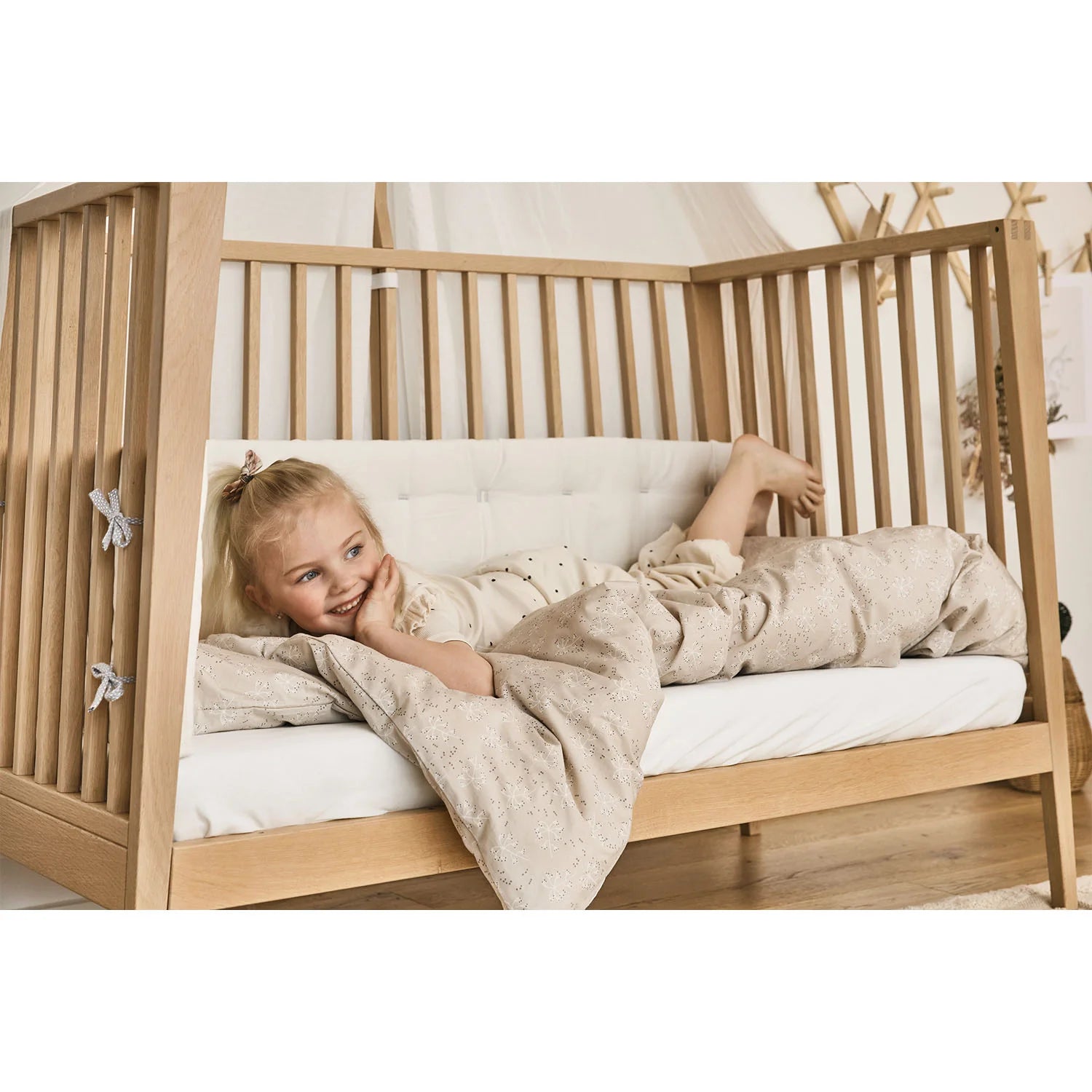 Removable side rail feature of the Leander Linea™ Baby Cot.