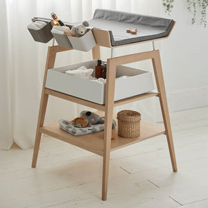 Safe and comfortable baby changing area with raised sides.