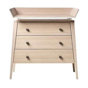 Elegant nursery storage dresser with integrated changing space.