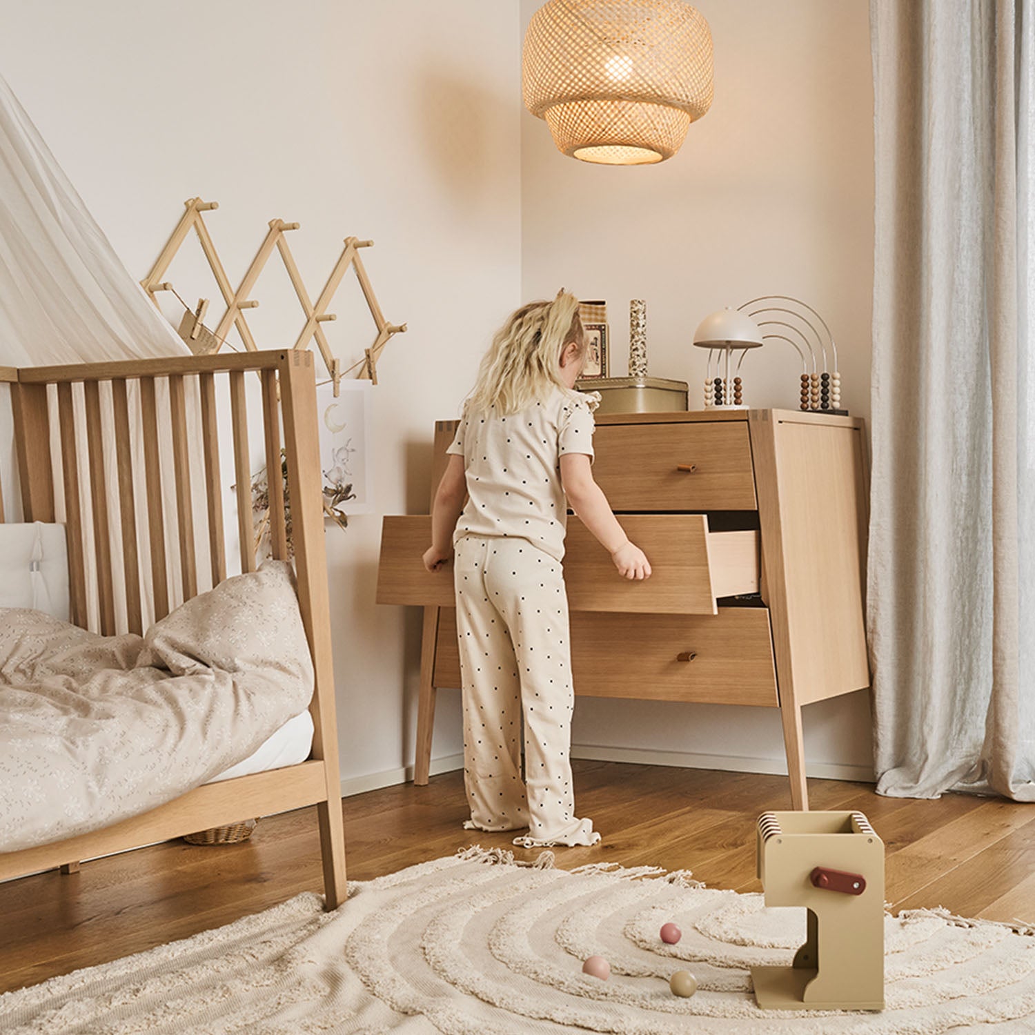 Functional nursery dresser with smooth soft-close drawer system.