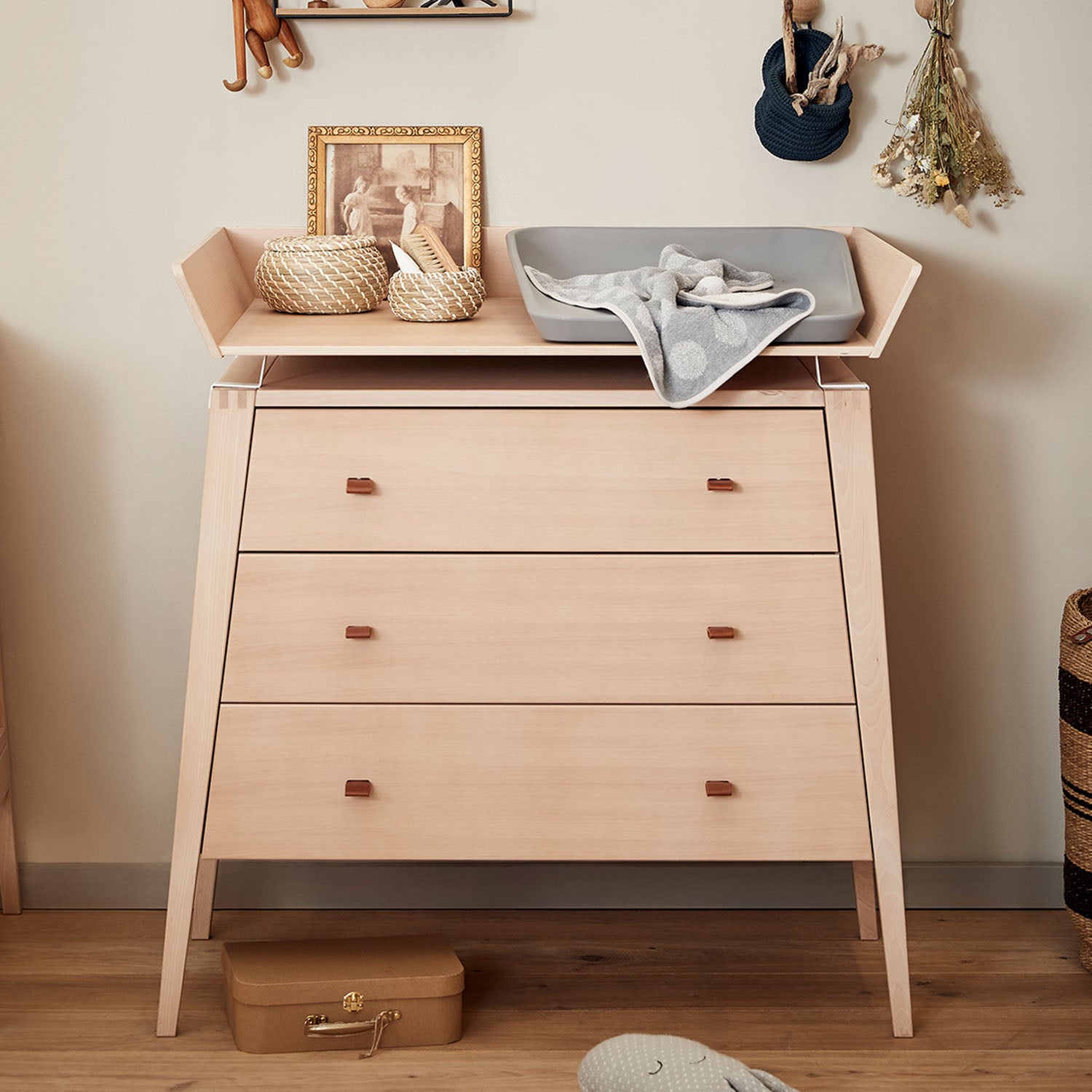 Nursery setup with Leander Linea dresser used as changing table.