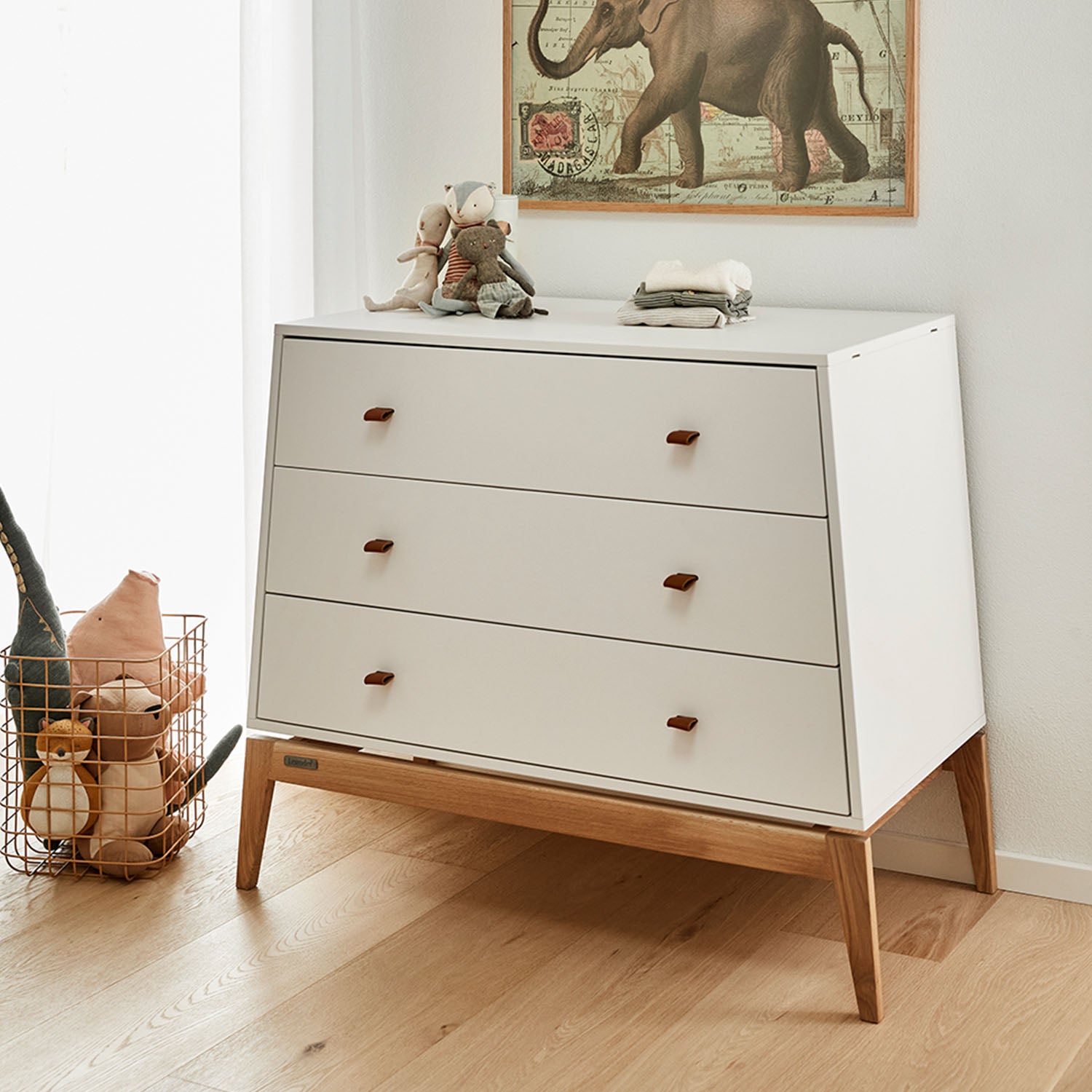 Spacious drawers open, showing storage for baby clothes and essentials.